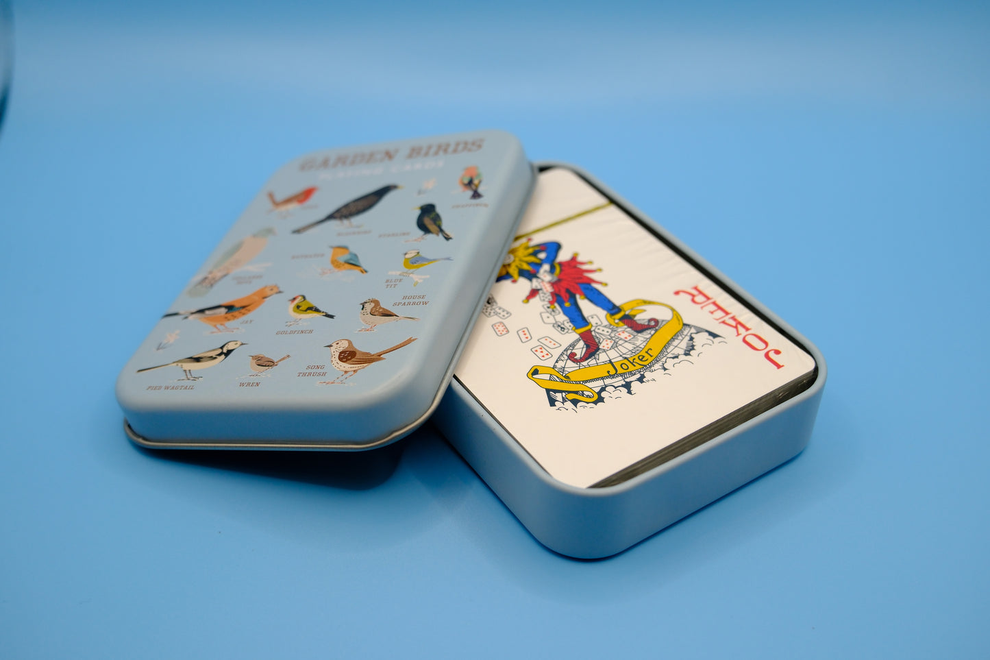 Blikje met speelkaarten vogels